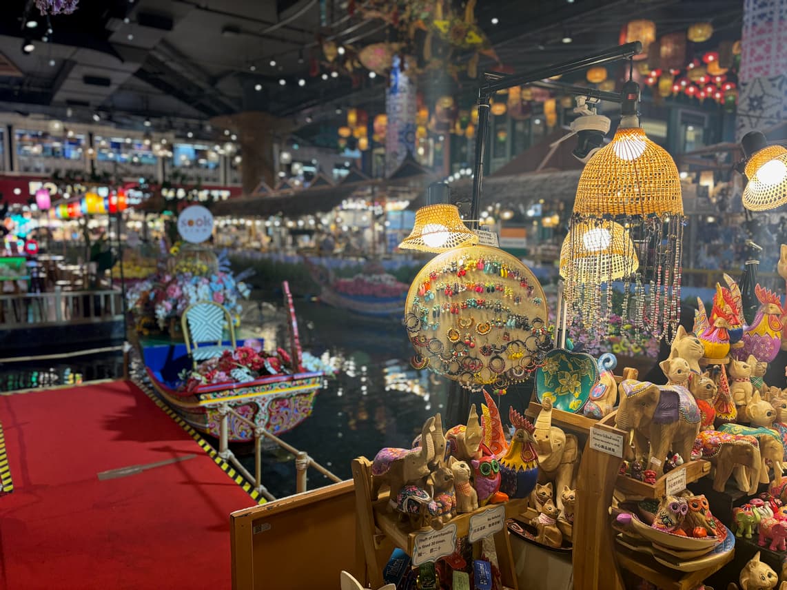 A shop stall in a market hall of a mall inspired by floating markets.